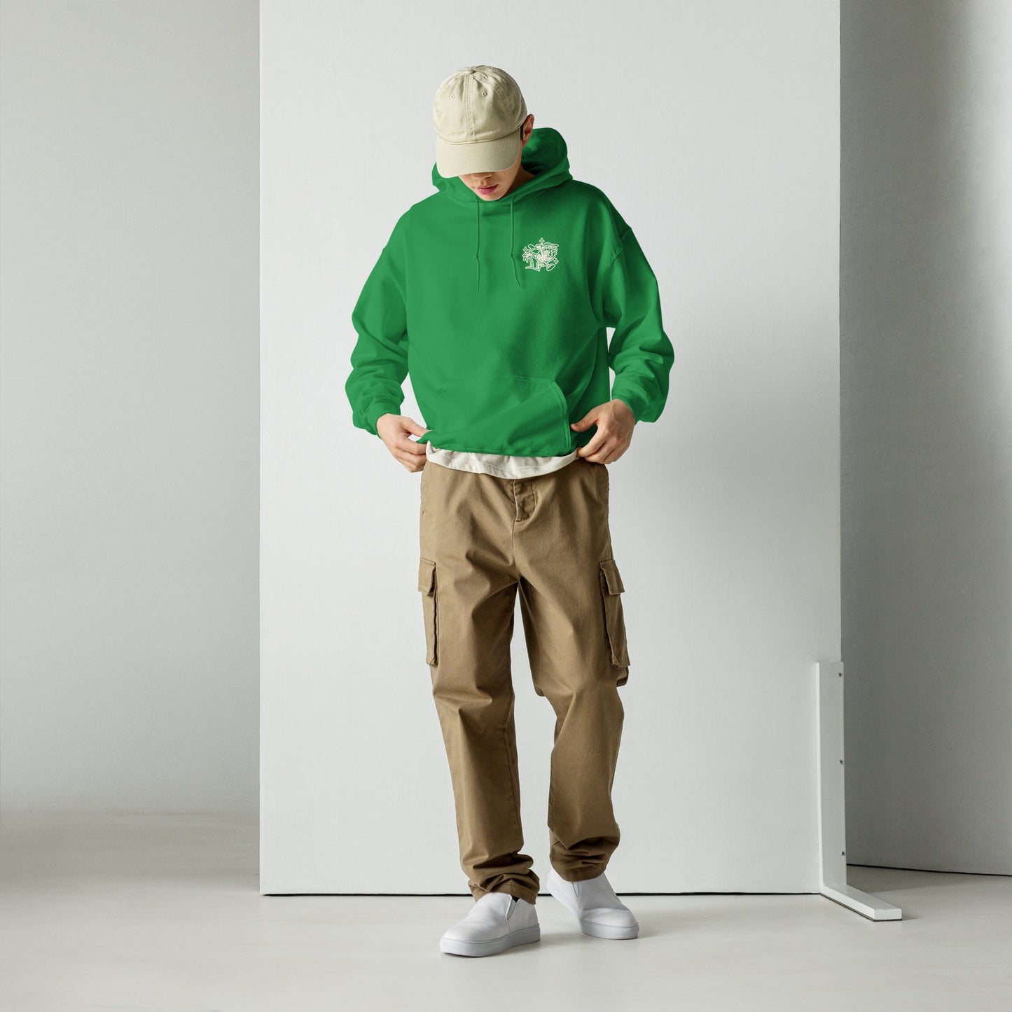 Male model wearing Ting's green unisex hoodie with Ting's logo on front