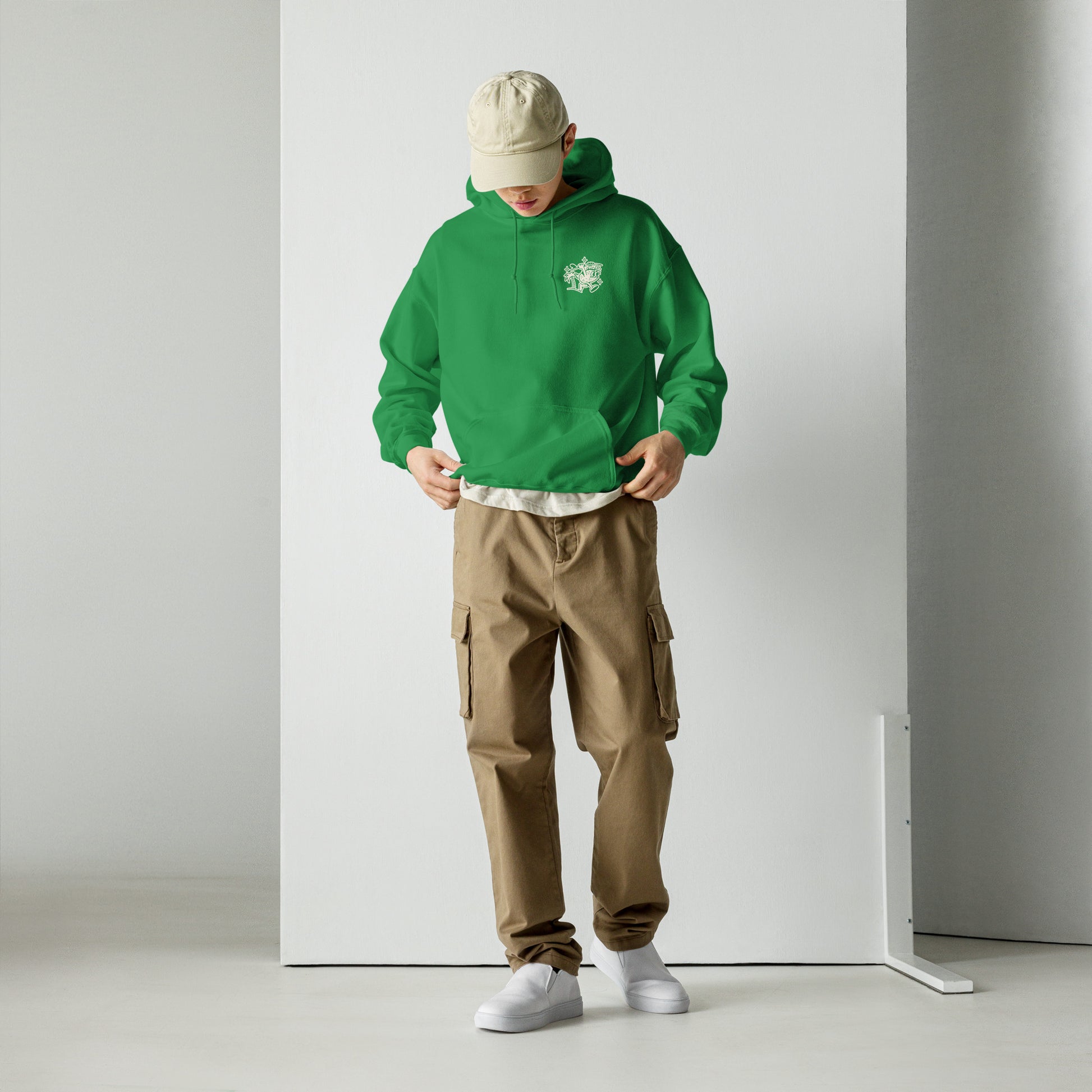 Male model wearing Ting's green unisex hoodie with Ting's logo on front